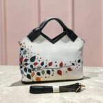 M cut satchel